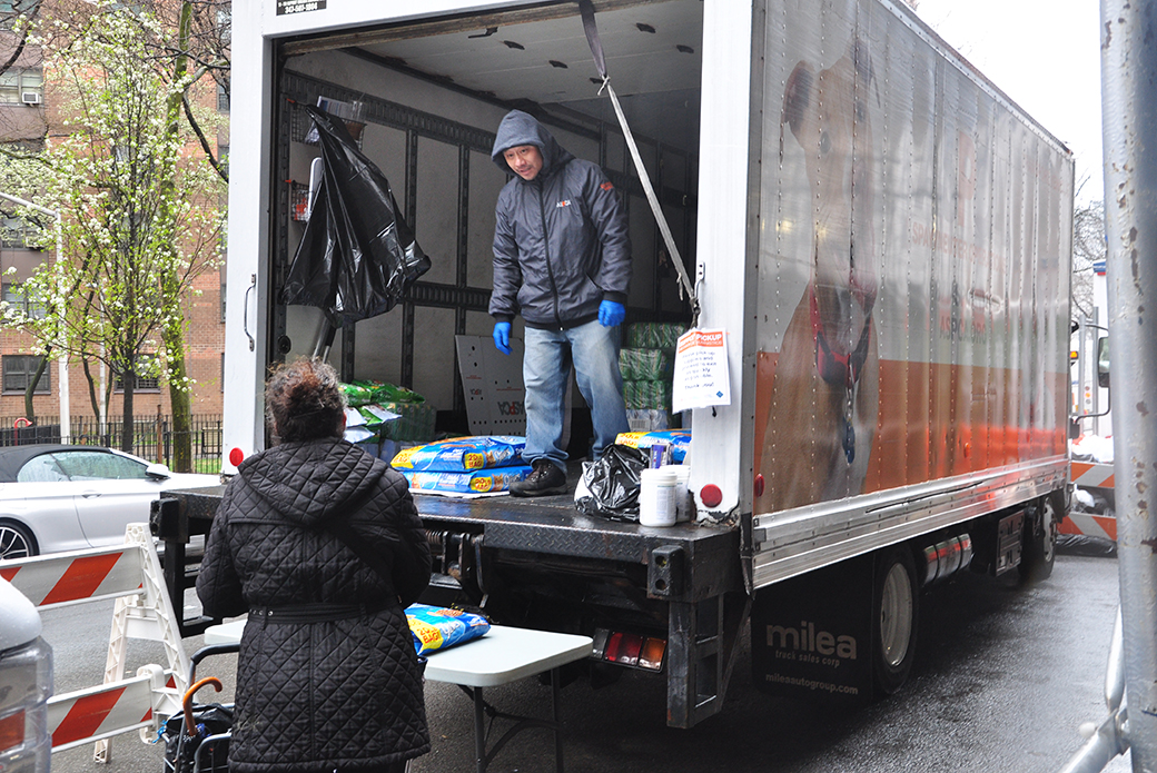 ASPCA staff moving pet food bags