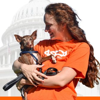 Woman holding dog