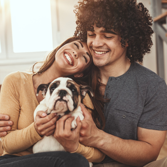 Couple holding dog